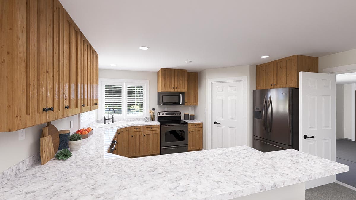 Kitchen with wood cabinetry, granite countertops, stainless steel appliances, and a large kitchen island.