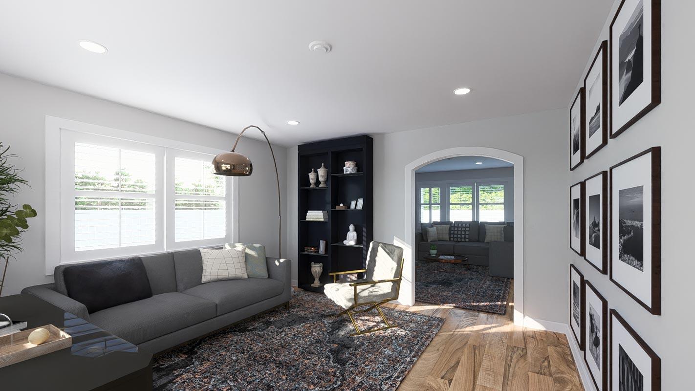 Living room with gray sofa, black bookshelf, arched doorway to great room with sofa, and gallery wall.