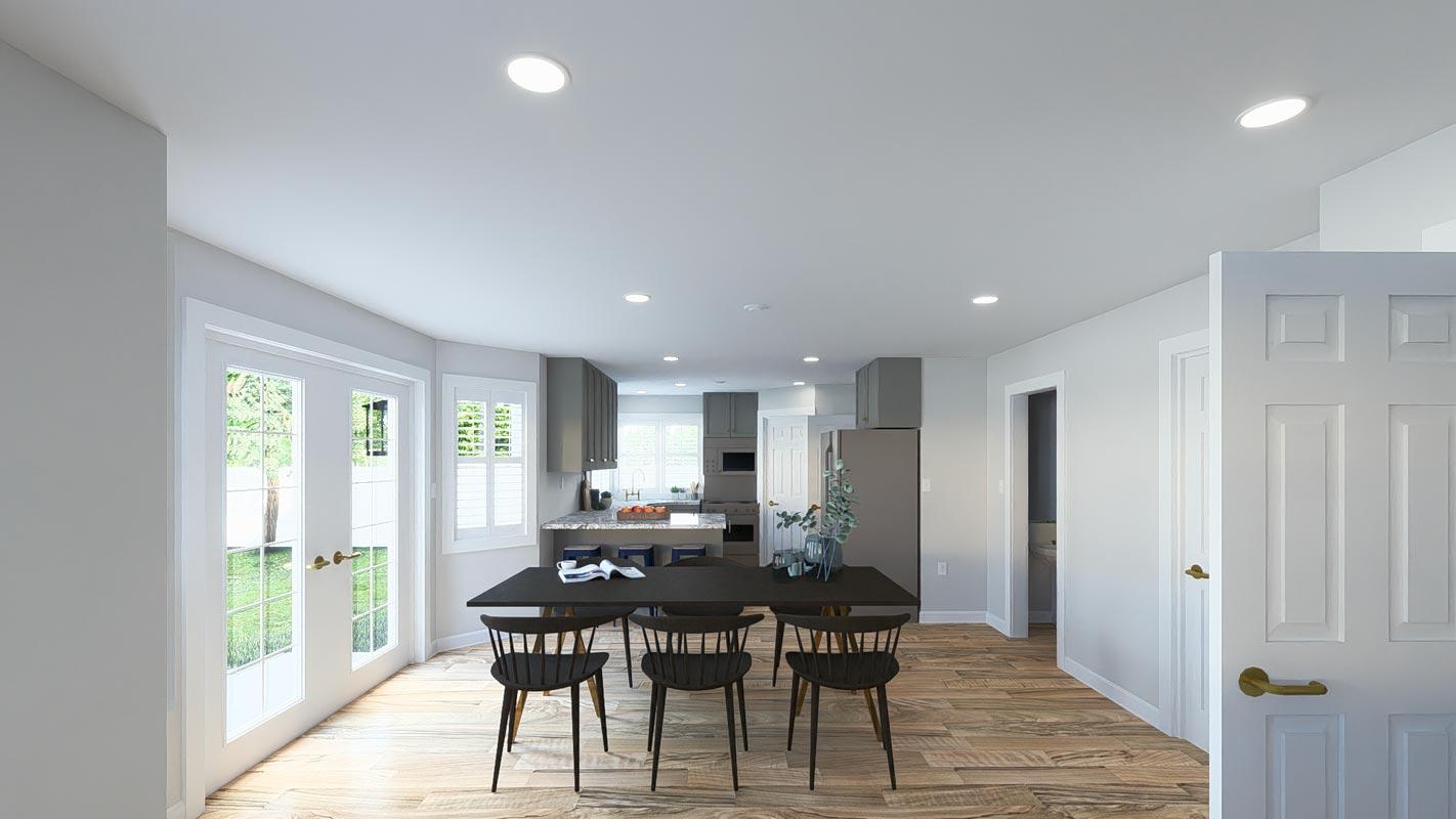 Open concept dining area and kitchen with gray cabinets, granite countertops, and stainless steel appliances.