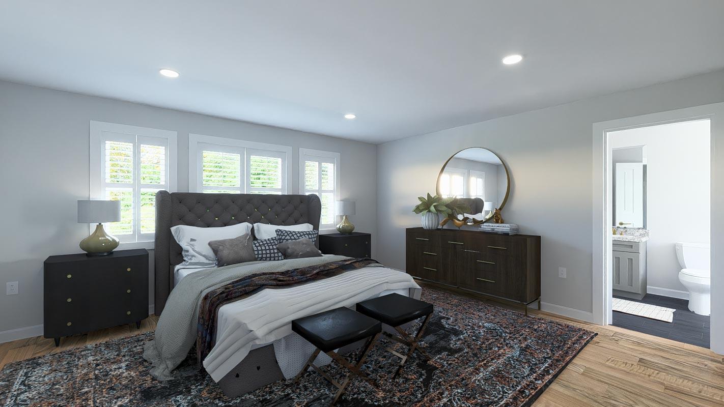 Primary bedroom with tufted headboard, three windows with shutters, and an adjacent bathroom.