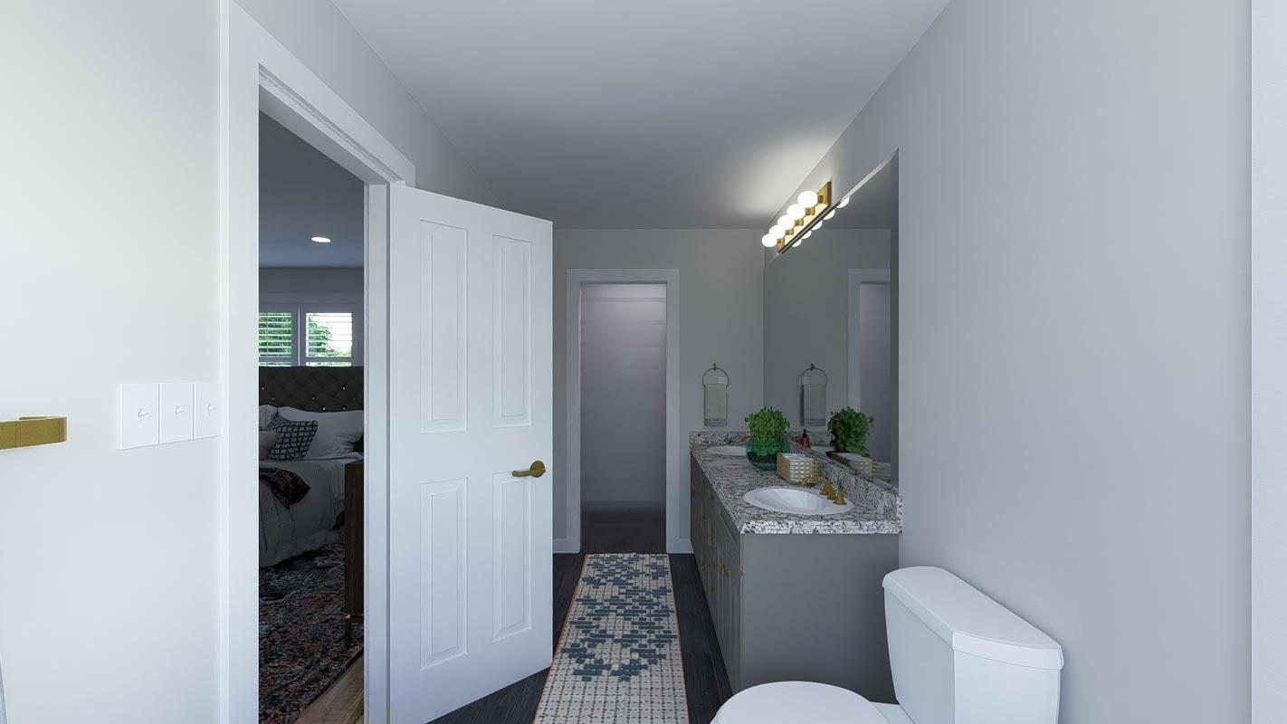 Bathroom with double vanity, granite countertops, and view into bedroom with tufted headboard and plantation shutters.