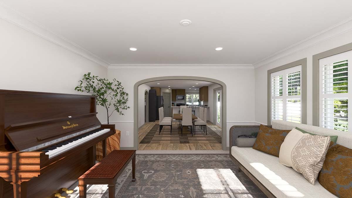Interior view showing a living room with a piano and archway leading to a dining room and kitchen.