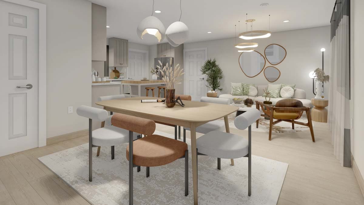 Dining area and kitchen with island, light wood table, modern chairs, and sofa in background.