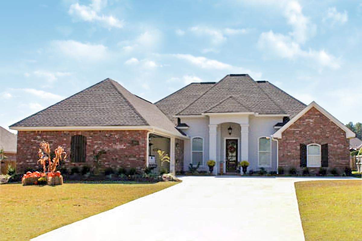 House plan exterior. One-story Ranch style. Features brick facade, gabled rooflines, and a covered porch with columns.