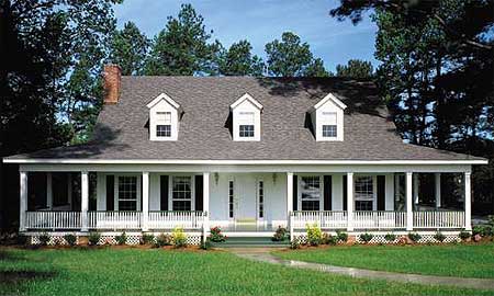 House plan exterior: two-story home with wrap-around porch, three dormers, and brick chimney.