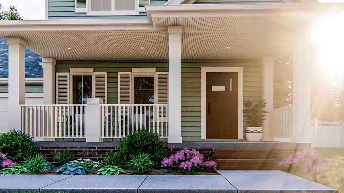 House plan exterior showing a covered front porch with white railings, green siding, and a dark wood door.