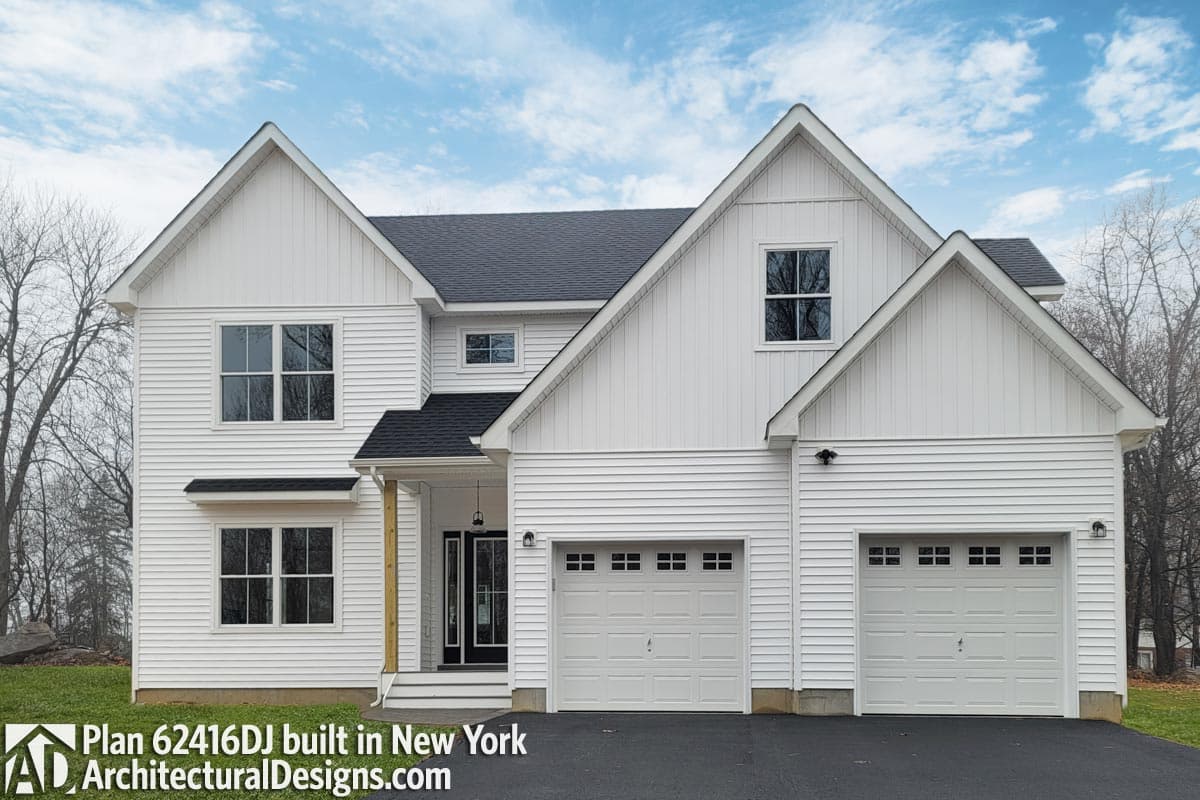 House plan exterior with two stories, gabled dormers, prominent front gables, and a two-car garage.