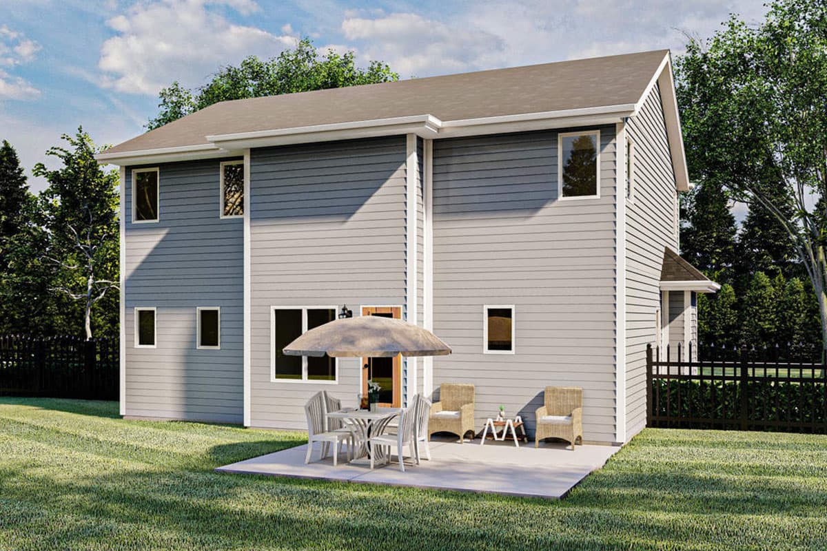 Two-story house plan exterior with horizontal siding, multiple gables, and a concrete patio with outdoor furniture.