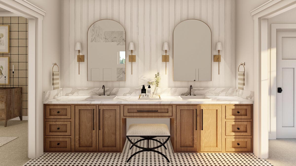 Bathroom with double vanity, marble countertops, wood cabinets, arched mirrors, wall sconces, and black and white tile floor.