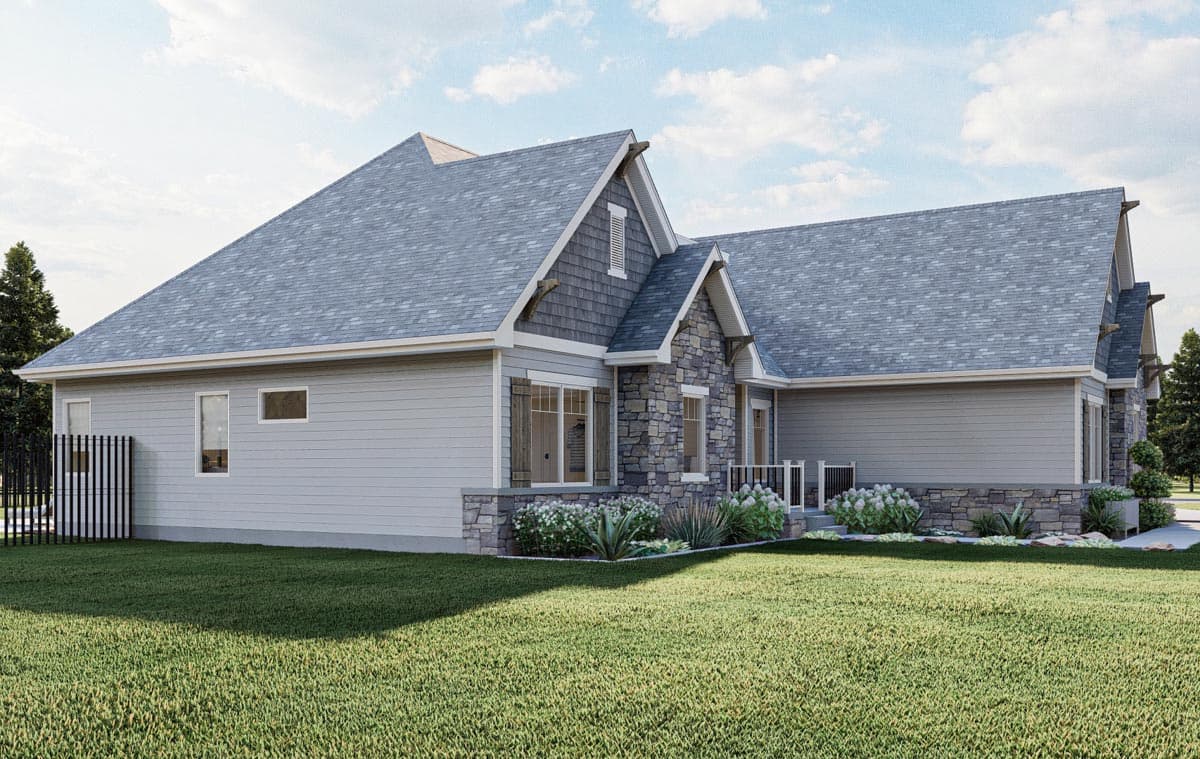 House plan exterior with stone and shingle accents, gable rooflines, and multiple dormers.
