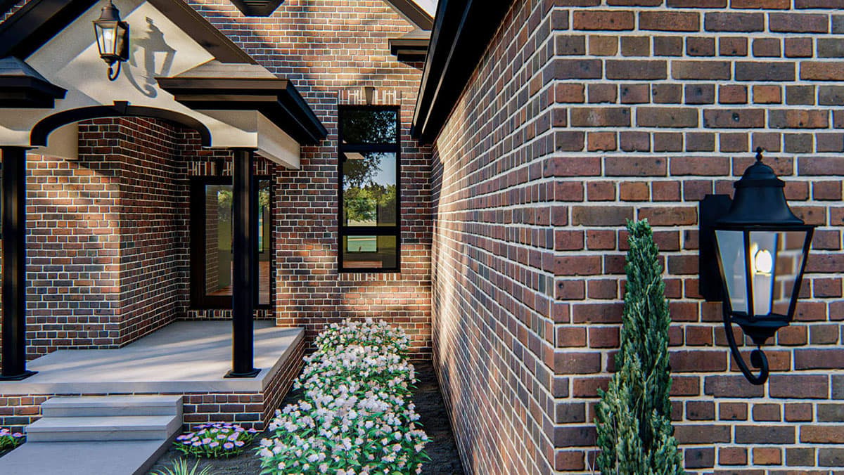 House plan exterior with brick facade, covered porch with columns, and a tall rectangular window.