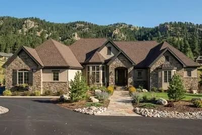 European French Country House Plan with One Bedroom and Three-Car Garage