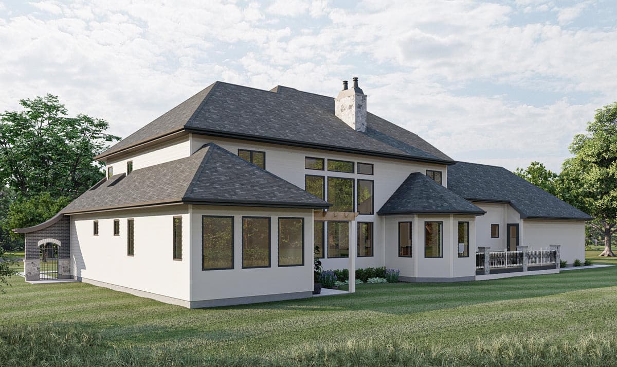 Modern house plan exterior with a multi-level roof, expansive windows, stone chimney, and a partial brick enclosure with a gate.