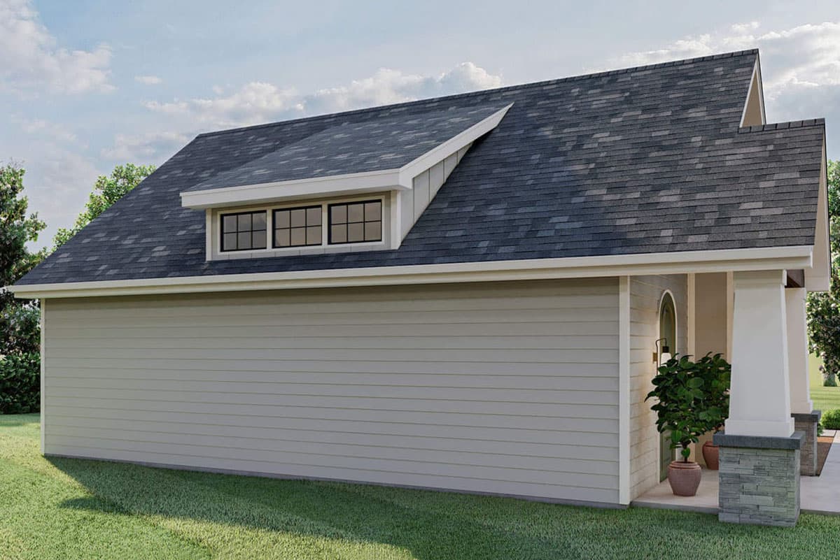 House plan exterior, two-story with a prominent dormer featuring three windows and a multi-level roof.