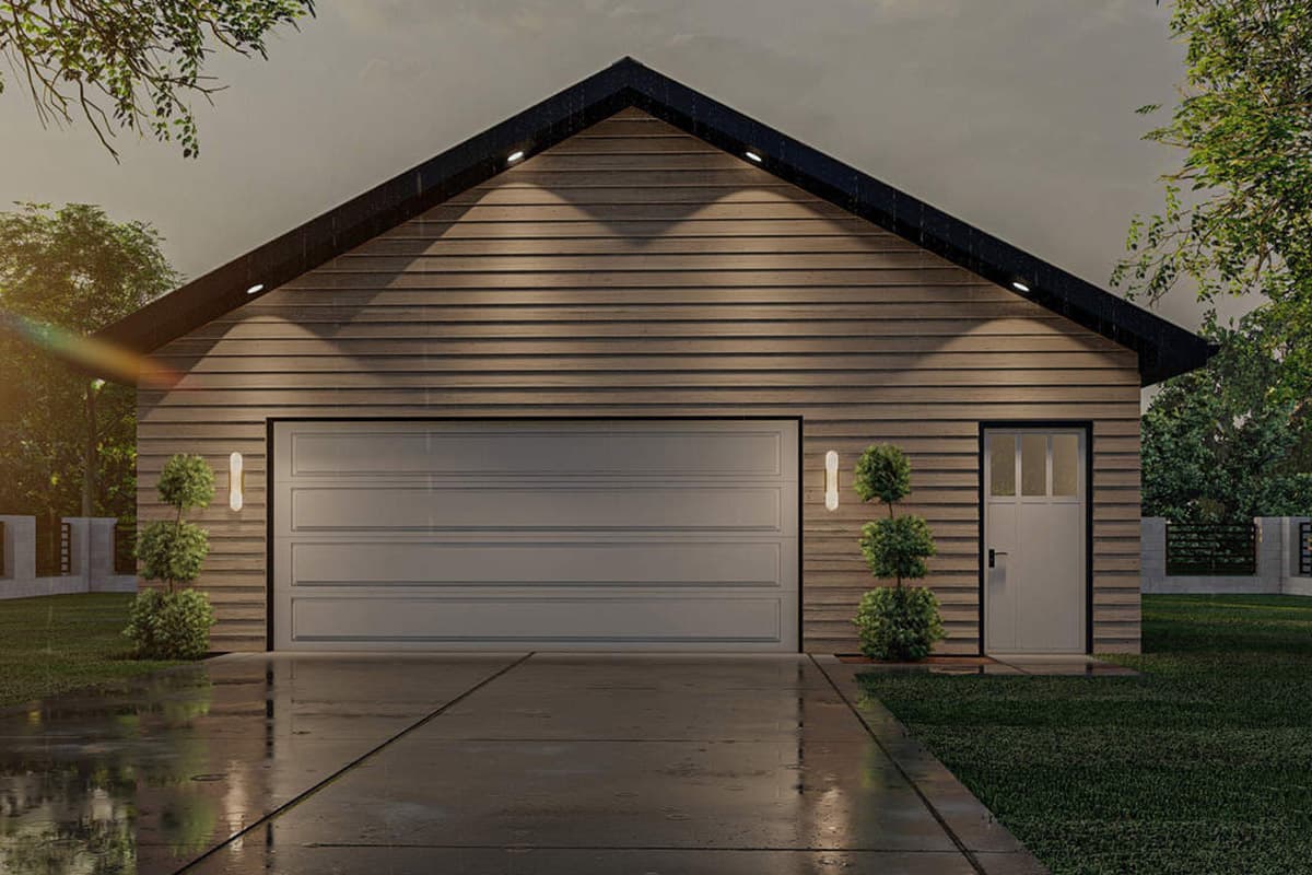Garage exterior with horizontal siding, one large garage door, and one pedestrian door. Gabled roof.