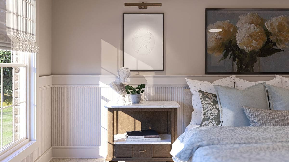 Bedroom interior with beadboard wainscoting, a marble-top nightstand with busts and plants, and artwork above the bed.