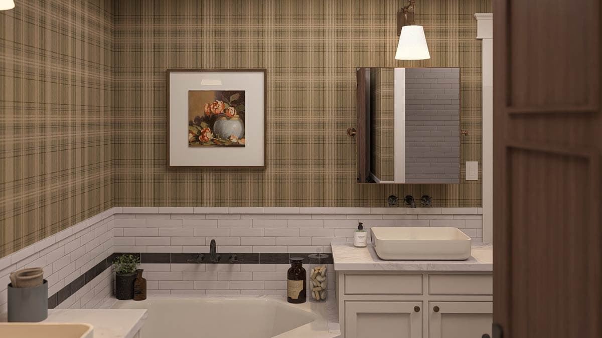 Bathroom with plaid wallpaper, subway tile wainscoting, bathtub, vessel sink, and framed floral art.