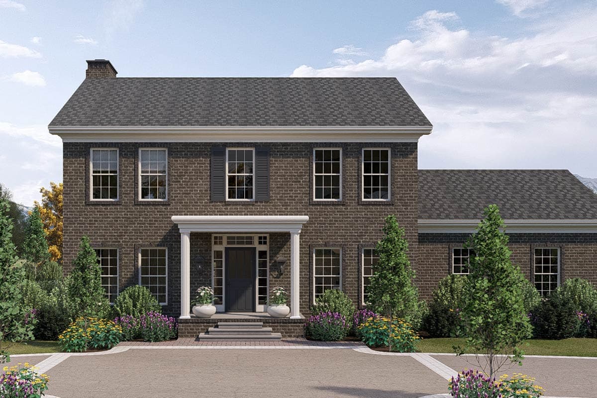 House plan exterior: Two-story brick home with a covered portico, symmetrical windows, and a prominent chimney.