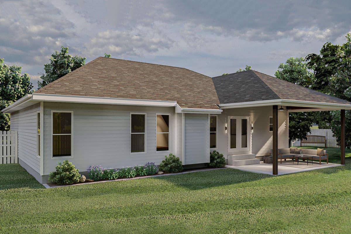 House plan exterior: Ranch style, single story with vinyl siding, multiple rooflines, and covered patio with seating.