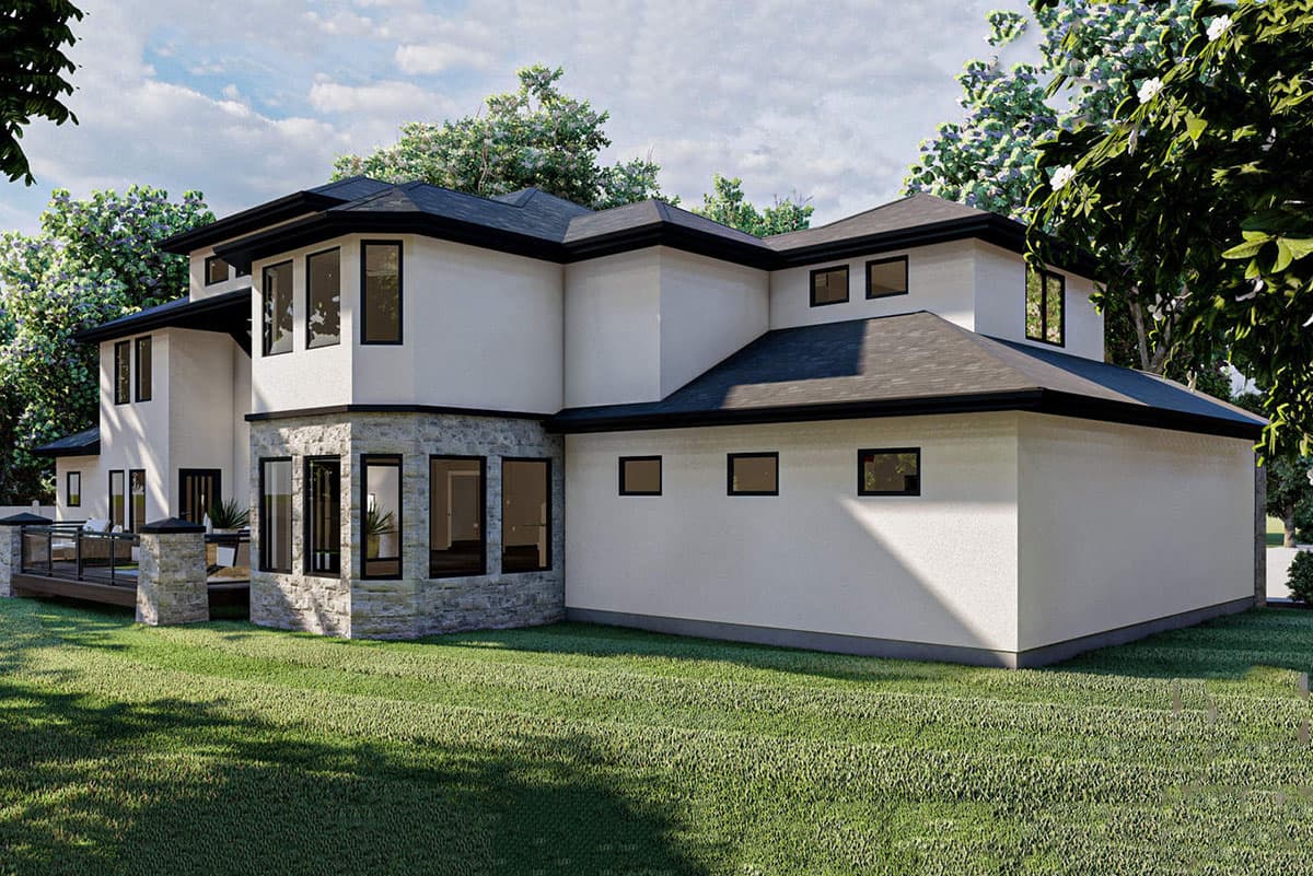 Modern two-story house plan exterior with stone accents, multiple gables, and a large deck area.