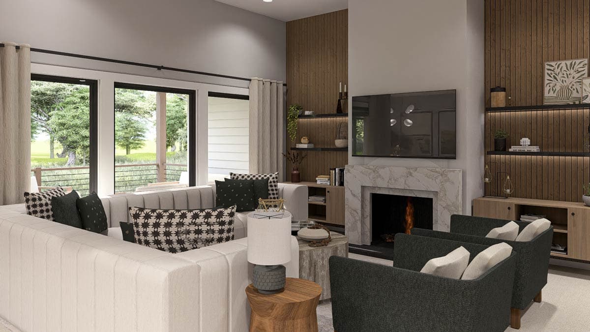 Great room with sectional sofa, marble fireplace, and wood-paneled wall with built-in shelves and TV.
