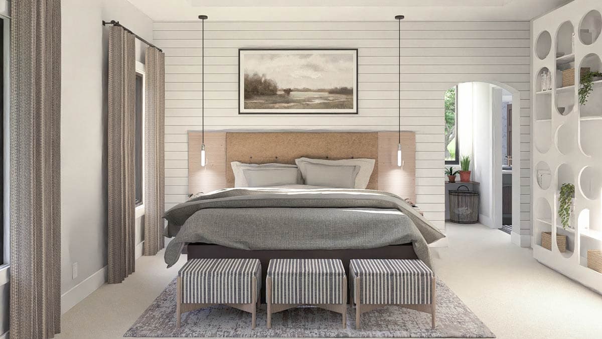 Primary bedroom with shiplap accent wall, king bed, pendant lights, and decorative shelving unit.