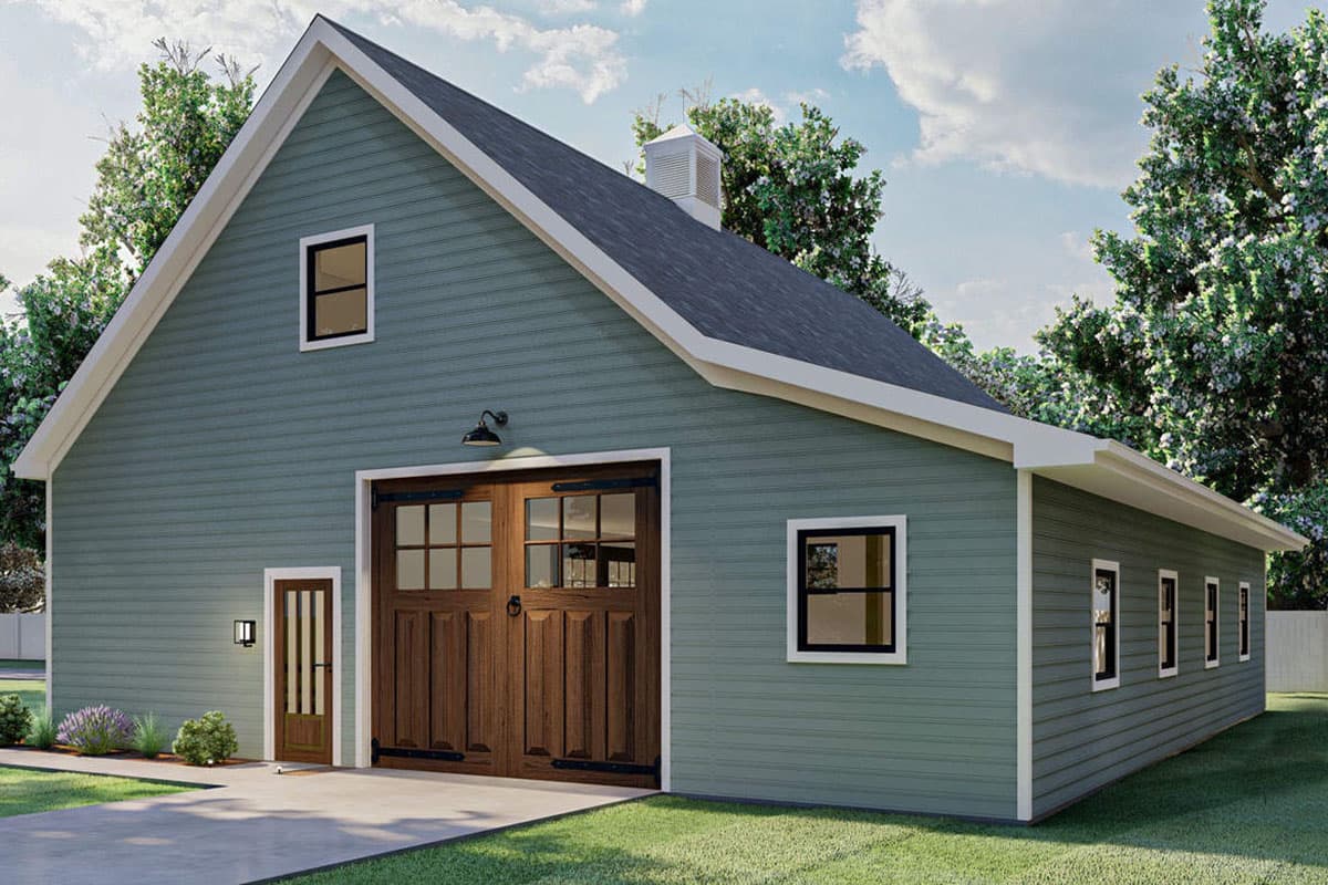 House plan exterior featuring a gambrel roof, two-car garage doors with glass panes, a side entry door, and several windows.