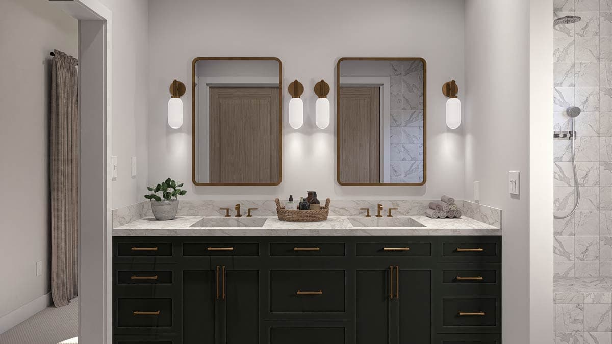 Bathroom with double vanity, marble countertop, dark green cabinets, two mirrors, and tiled shower.