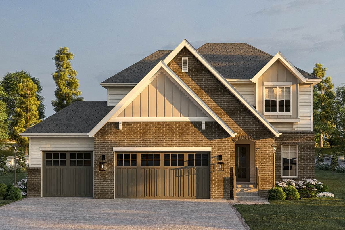 House plan exterior. Two-story home with a gabled roof, brick facade, and multiple dormers. Features a two-car garage.