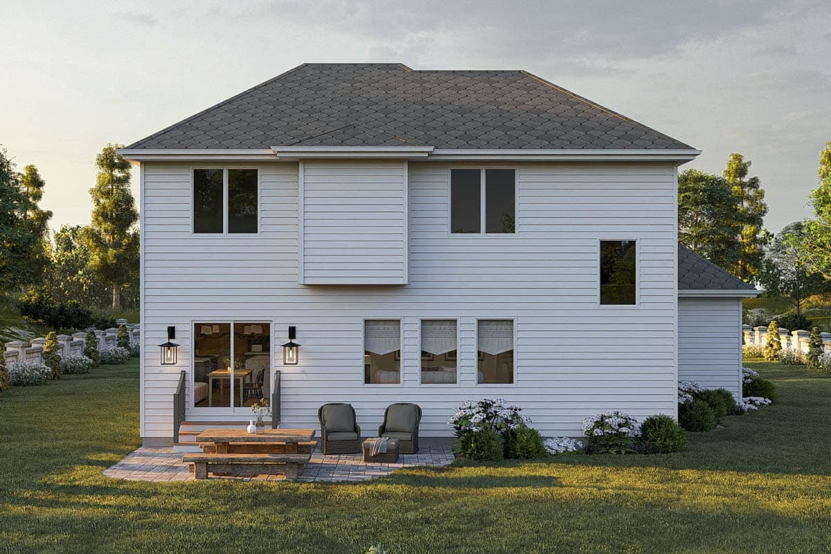 House plan exterior: Two-story white vinyl-sided home with a gray shingle roof, multiple windows, and sliding glass doors leading to a patio.