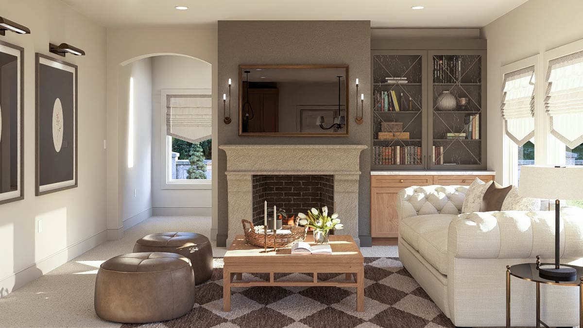 Living room with stone fireplace, built-in bookshelves, and arched doorway. Open layout.