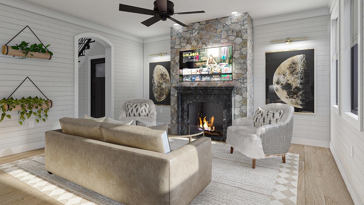 Living room rendering with stone fireplace, television, sofa, chairs, and arched entryway to stairs.
