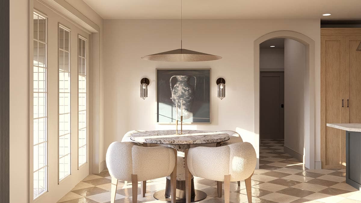Dining area with round table and chairs, arched doorway to hallway, and tall windows.