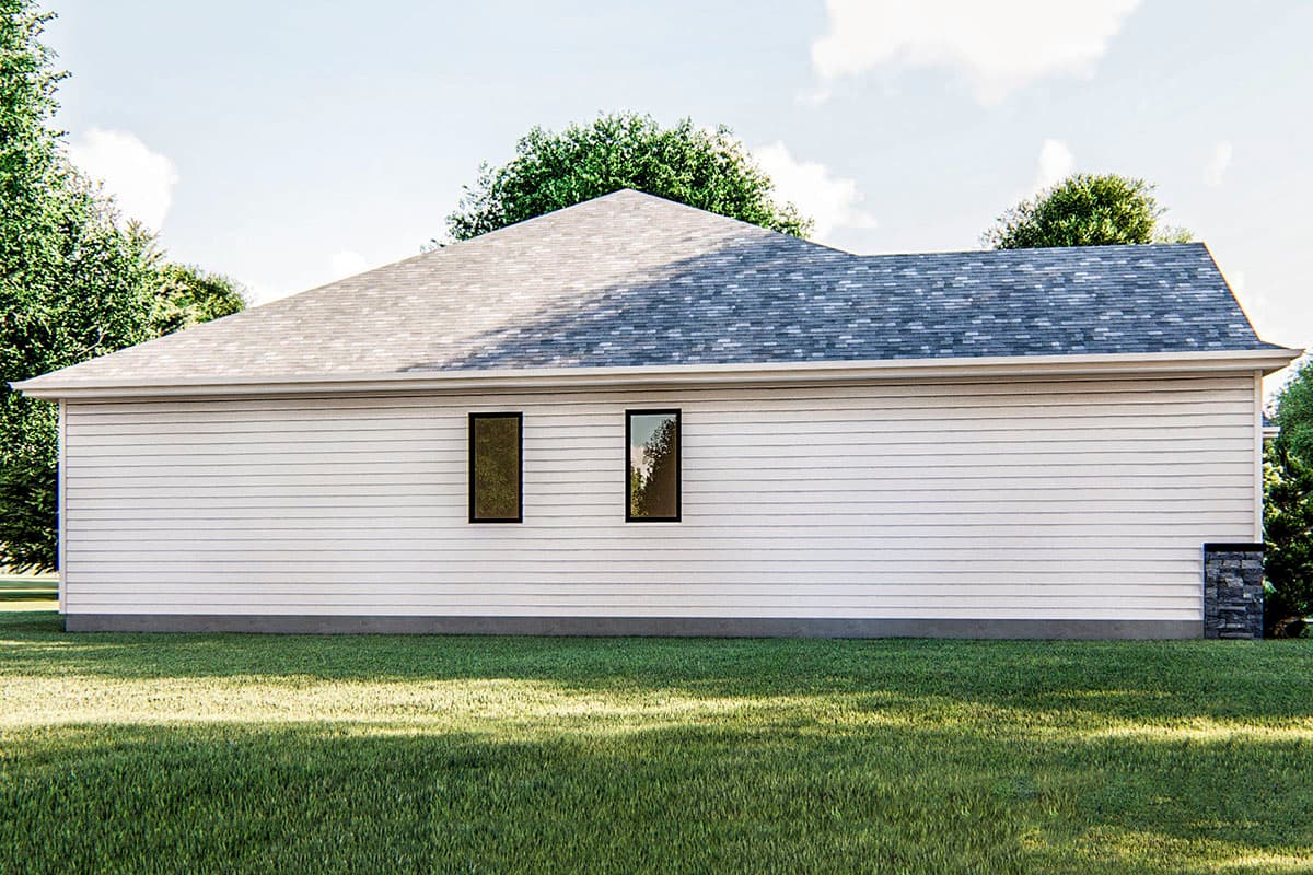 House plan exterior, single-story, white lap siding, hip roof, two small casement windows, stone foundation accent.
