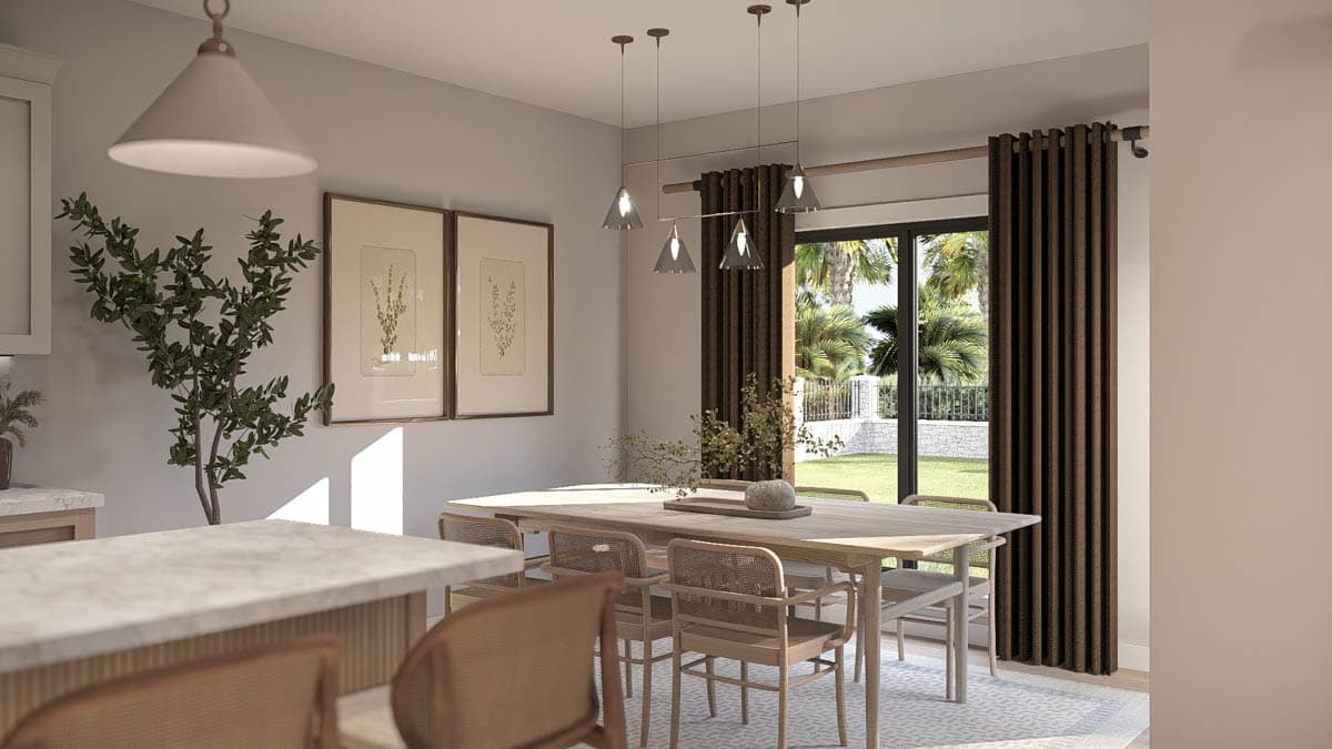 Dining area with light wood table, cane-back chairs, pendant lights, and large sliding glass door with outdoor view.