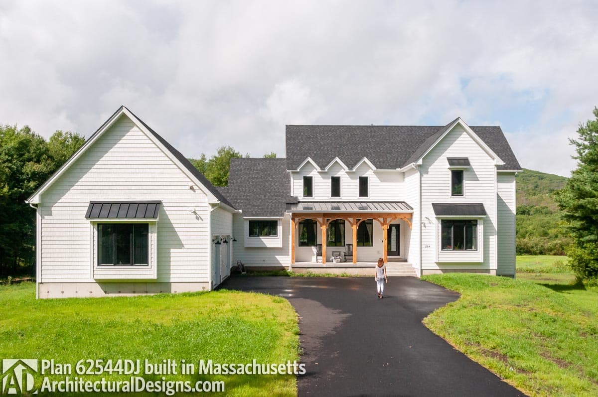 House plan exterior: Two-story Modern Farmhouse with a covered porch, gables, and attached garage.
