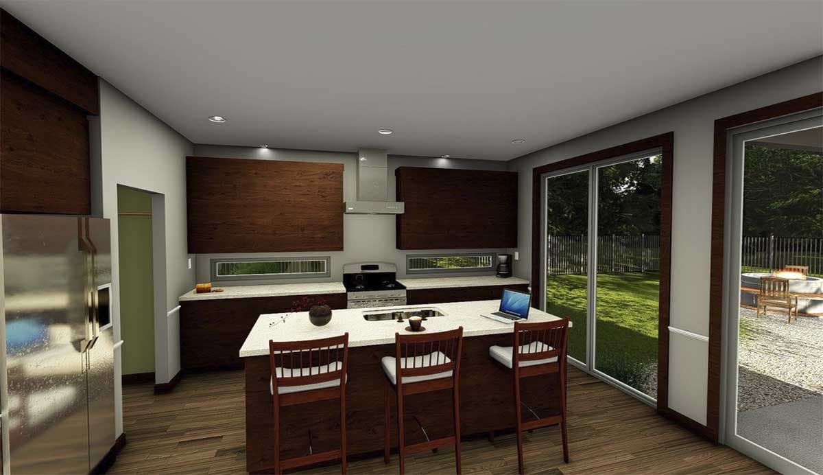 Kitchen with island, stainless steel appliances, dark wood cabinetry, and sliding glass doors to backyard.
