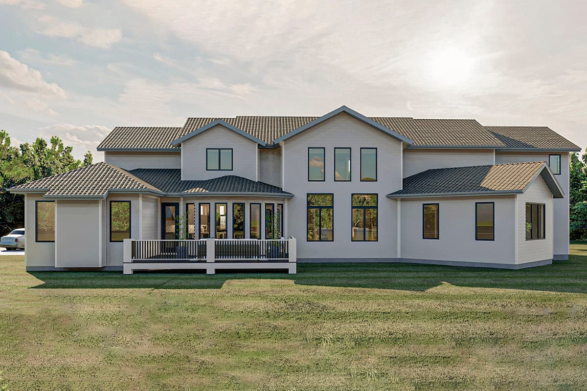 House plan exterior. Two-story home with multiple gables, large windows, a covered porch, and a pitched roof.