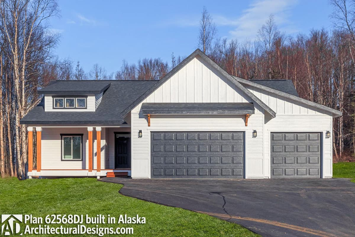 House plan exterior: single-story Modern Farmhouse with a gable roof, dormer, covered porch, and a 2-car attached garage.