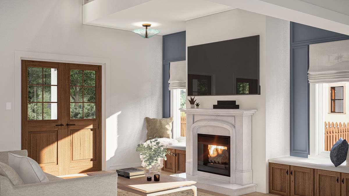 Interior view of a living room with double wood doors, a fireplace, and a window seat with storage.