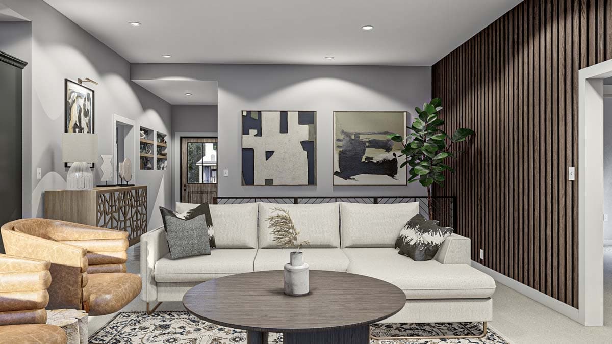 Living room with sectional sofa, abstract art, slatted wood accent wall, and leather chairs.