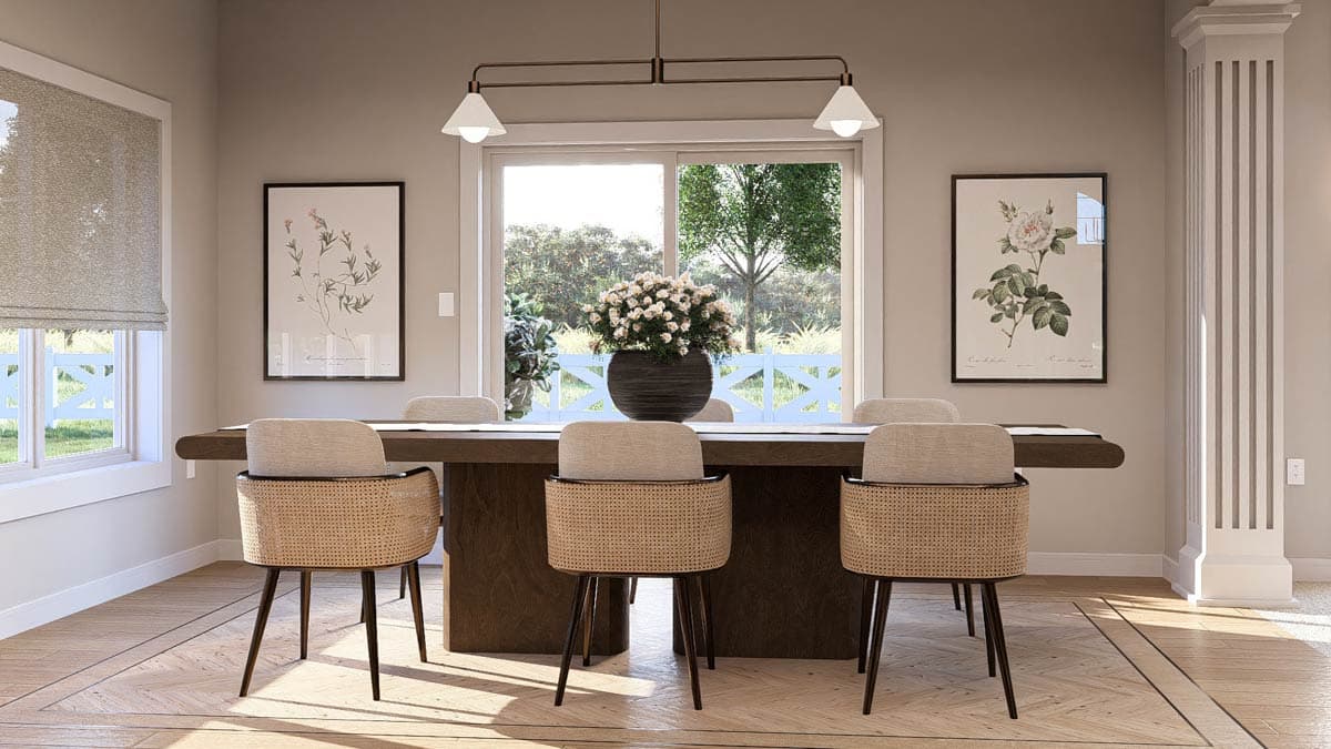 Dining room with large dark wood table, cane-backed chairs, floral art, and sliding glass doors.