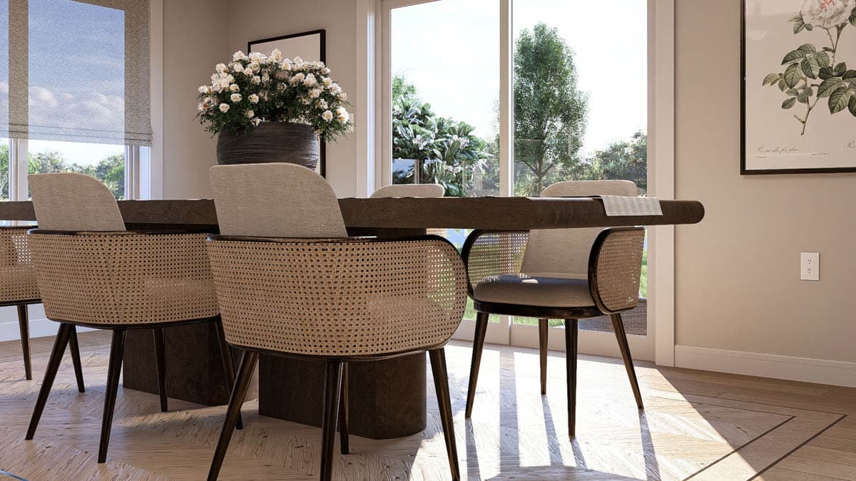 Dining room with dark wood table, cane-backed chairs, and large windows overlooking garden.