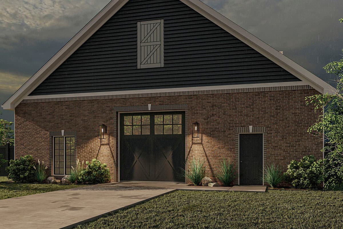 House plan exterior with brick facade, dark siding gable, large garage door, a single entry door, and two windows.