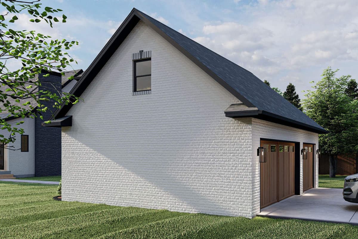 House plan exterior of a white brick building with a gabled roof, black trim, two garage doors, and a small attic window.
