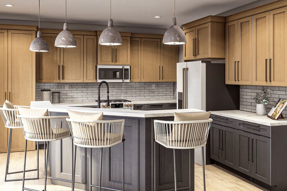 Kitchen with two-tone cabinets, large island with bar stools, subway tile backsplash, and pendant lighting.
