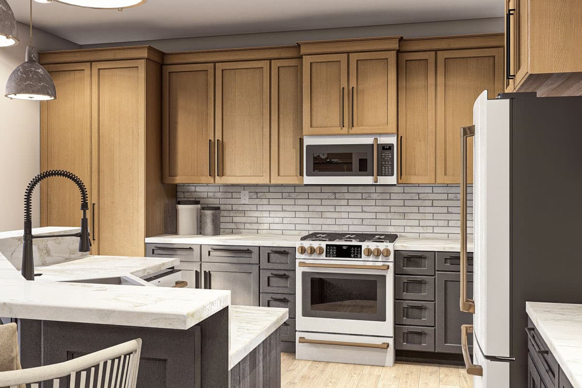 Kitchen with two-tone cabinetry, white subway tile backsplash, island with sink, and stainless steel appliances.