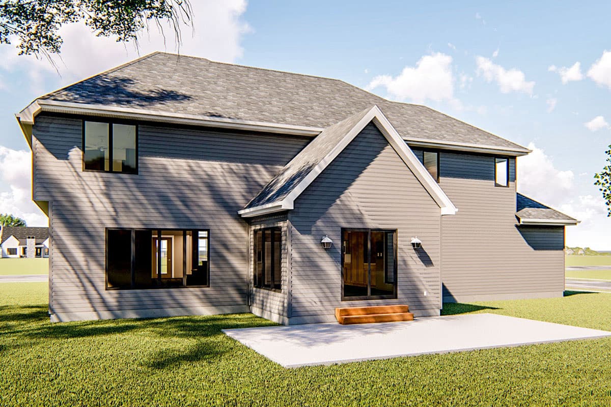 Two-story house plan exterior with gray siding, large windows, a gable roof over a bay window, and a concrete patio.