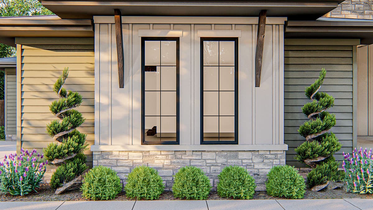House plan exterior featuring stacked stone base, board and batten siding, and dual tall windows with dark frames.