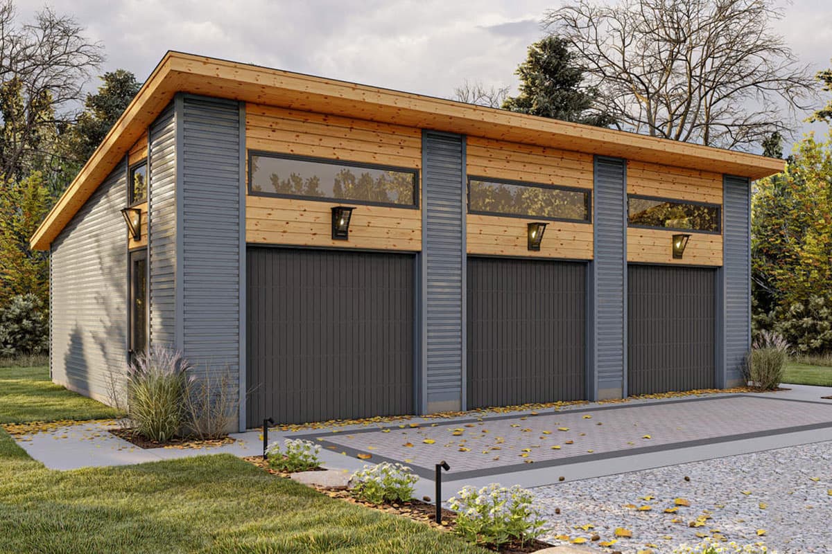 Modern three-car garage with a sloped roof, wood and metal siding, and three garage doors with transom windows above.